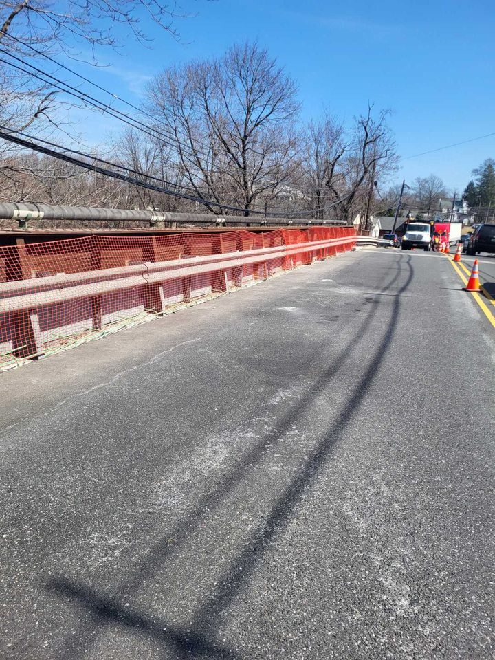 Maintenance Orphan Bridge Repair Contract 2025: bridge roadway with new rail/parapet repairs